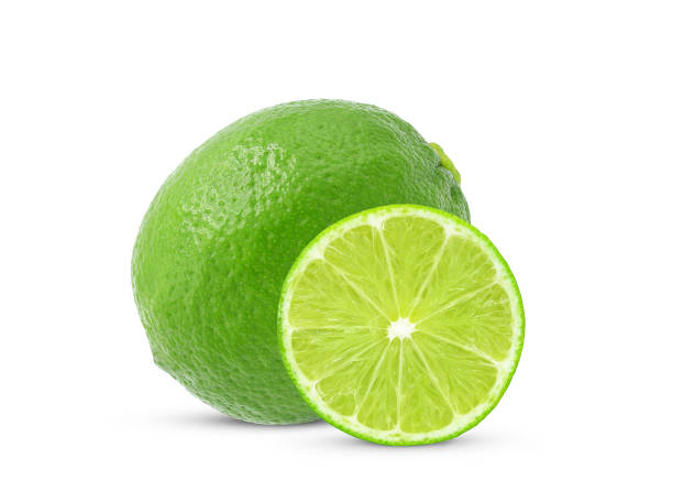 istock Whole and half of fresh lime fruit isolated on white 1414650827