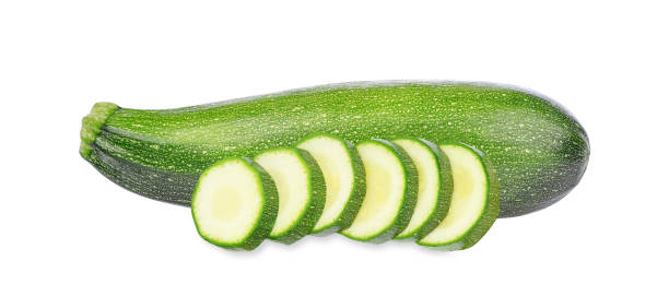 Whole zucchini and slices isolated on white Whole zucchini and slices isolated on white background. Whole Cucumber stock pictures, royalty-free photos & images