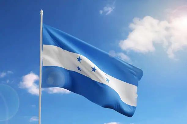 Flag of Honduras on blue sky. 3d illustration.