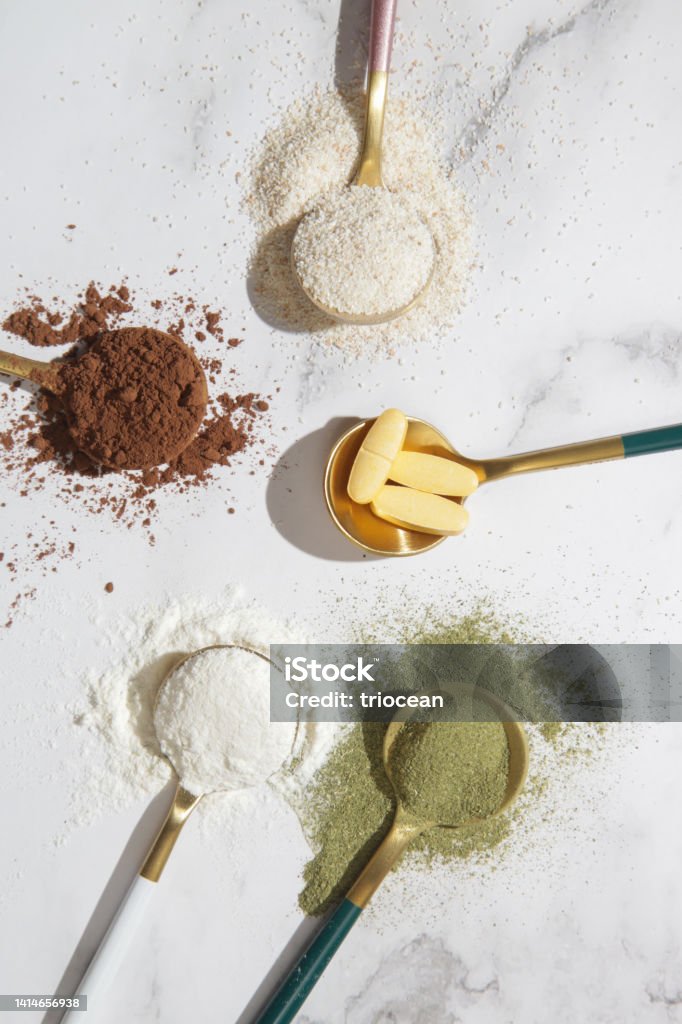 Different types of dietary supplements forhealth and beauty - collagen, vitamins, biotin, protein in pills and powder form Ground - Culinary Stock Photo