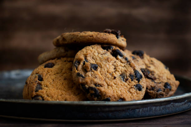 istock Cookies with chocolate on a dark background 1414660262