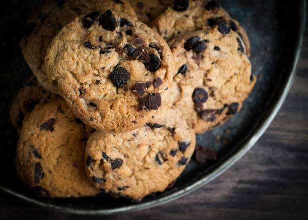 istock Cookies with chocolate on a dark background 1414660482