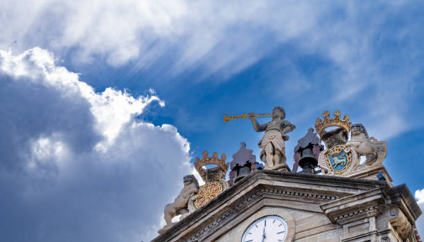 Upper facade of City Hall in Pamplona, Navarra, Spain with dramatic clouds.