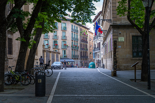 Pamplona, Spain - June 2, 2022: A quiet, shaded city street in downtown Pamplona.