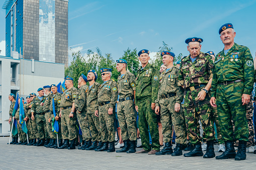 Kazan, Russia. 2022, August 02. Day of the Russian Airborne Forces (VDV). Veterans of the Russian Airborne Forces. Military men in uniform at the Airborne Parade, flag of the Airborne Forces