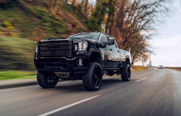 Black GMC Sierra Denali Tacoma, WA, USA
8/2/2022
Black GMC Sierra Denali driving on the street with trees in the background pick up truck stock pictures, royalty-free photos & images