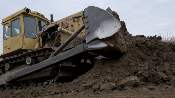 istock Bul'dozer removes dam in the delta Danube river. Close up 1414665873