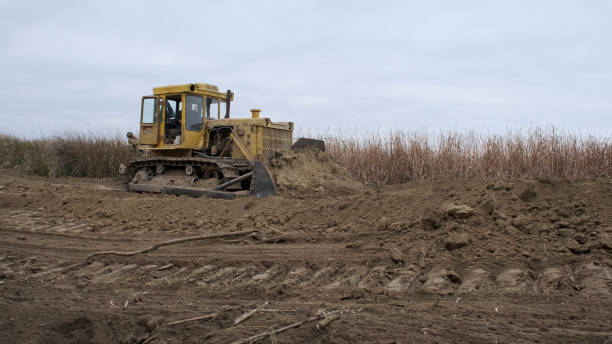 istock Bul'dozer removes dam in the delta Danube river. Close up 1414665894