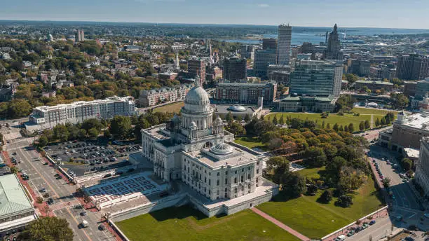 View of Capitol Hill with Rhode Island State House and streets of Providence behind. The marble dome of the State House is the forth-largest self-supporting marble dome in the world.