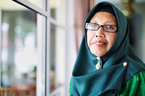 Senior woman facing the camera for a photograph