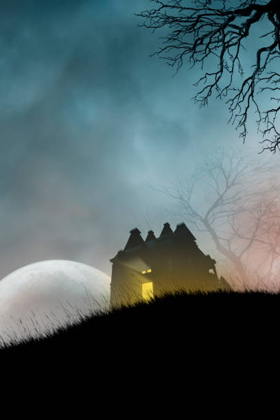 istock Haunted House On Hillside in Front of Large Moon 1414670647