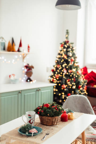 istock In Background is Christmas Tree with Bokeh Lights. Christmas Background. Kitchen Table Decorated 1414670649