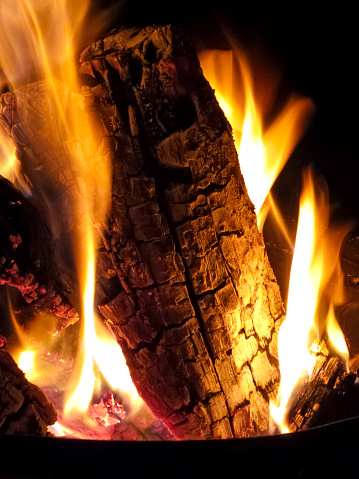 Closeup fire - flames - hot coals - black background