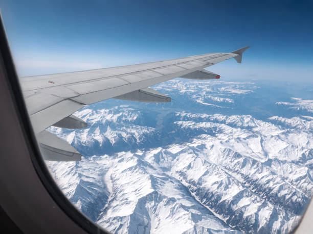 istock Airplane wing. View from plane window. Travel and transport concept 1414672857