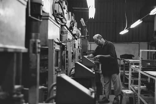 Heavy-machinery operator at a factory