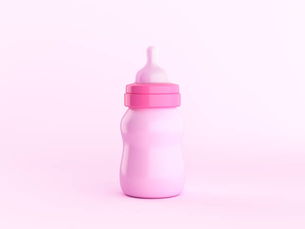 Baby milk with toys on pink background. Top view