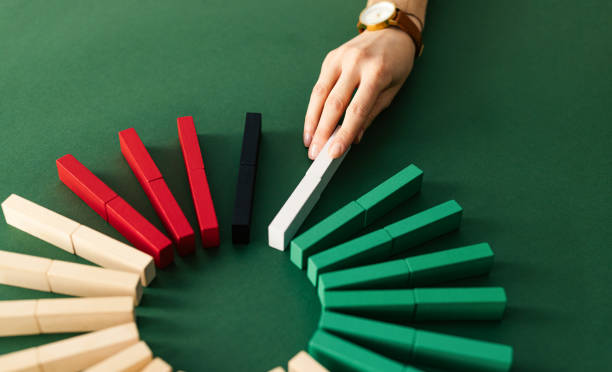 istock Unrecognizable Business Woman Placing Domino Pieces As Pie Chart 1414682578