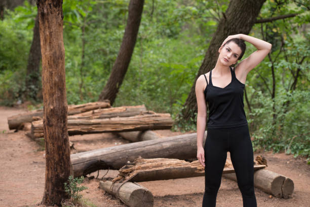 istock Attractive Woman Stretching Before Fitness And Exercise 1414688821
