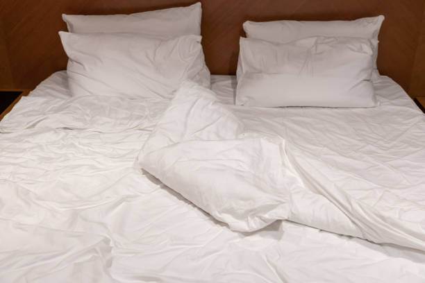 istock Crumpled linen on a large bed in a hotel 1414688932