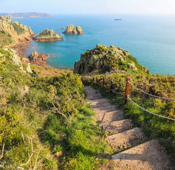 Photo of Steps down to the ocean along the beautiful coastline of Jersey Channel Islands