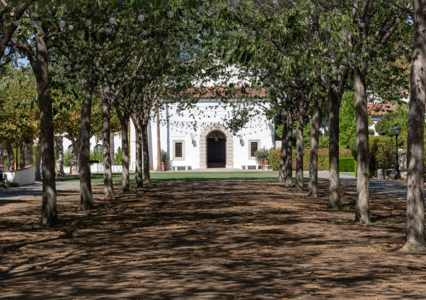 Scripps College Claremont, CA - August 13 2022:  View of a building at Scripps College through a corridor of trees claremont california photos stock pictures, royalty-free photos & images
