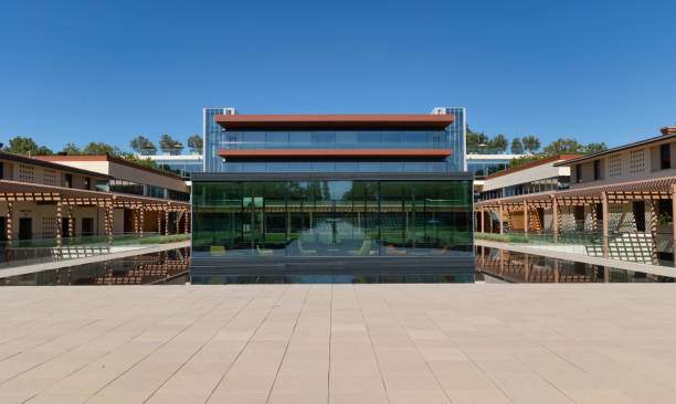 Reflection at the Claremont Colleges Claremont, CA - August 13 2022: Academic building at Claremont McKenna College reflected in a pool of water claremont california photos stock pictures, royalty-free photos & images