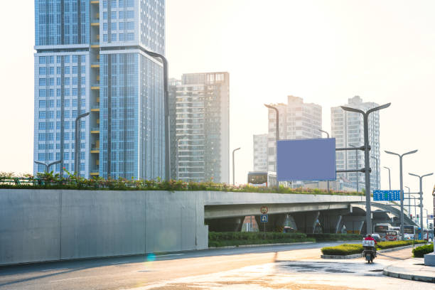 istock Sunny modern city and road 1414697615