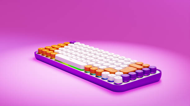 istock Gaming keyboard with RGB light. Rainbow keyboard with round keys, on a pink background. 3D render. Equipment for gamers 1414701848