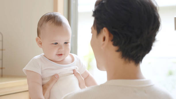 istock young asian father enjoying with baby 1414704642
