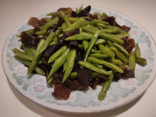 istock Stir-fried chickpeas with ear mushrooms 1414706141