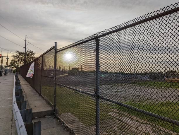 istock Metal fence and guardrail overlooking power distribution yard 1414708864