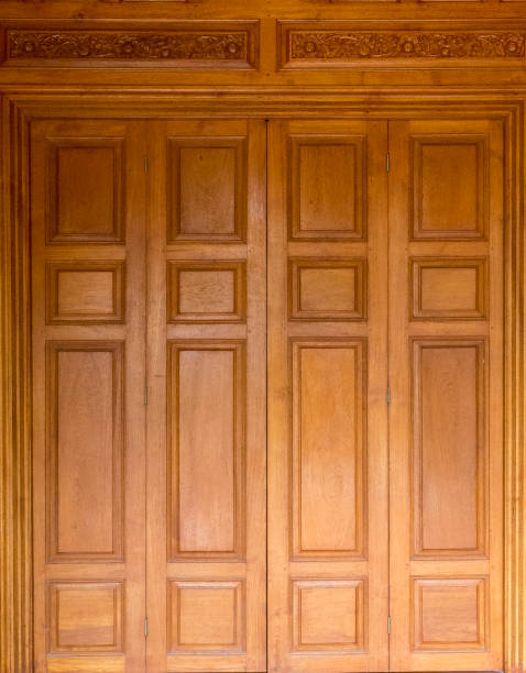 istock Teak wood door with thai style house frame thai architecture 1414708985