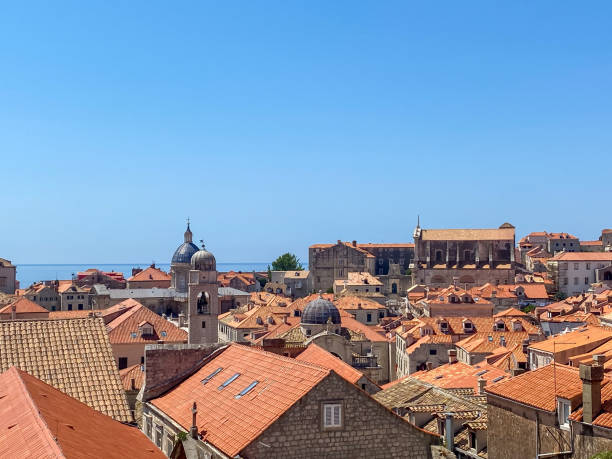 Medieval architecture in the walled city and the rugged coastline of Dubrovnik, Croatia with views of the Adriatic Sea stock photo