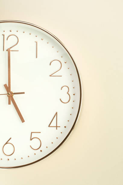a wall clock that signals the hour - 5 horas imagens e fotografias de stock