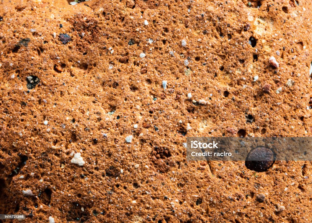 3x magnified view of a sandstone rock with inclusions. Rock - Object Stock Photo