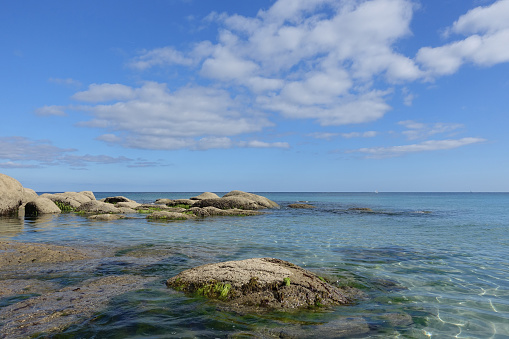 Rising tide  Calm and transparent sea  Coastline  Rocky coast  Horizon line above the water   Bretagne Finistère France