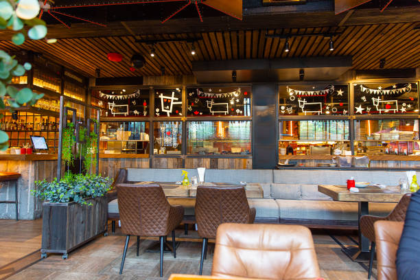 istock Interior of modern loft style restaurant with live plants 1414725355