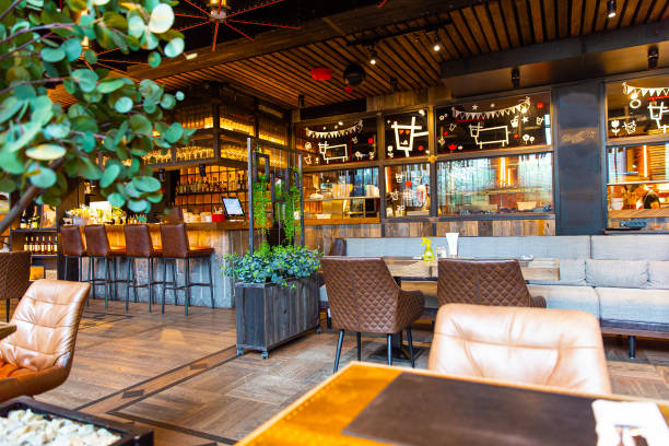 istock Interior of modern loft style restaurant with live plants 1414728875