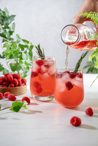 istock Summer refreshing non-alcoholic cocktails. Raspberry lemonade garnished with fresh rosemary. Summer raspberry beverage with sparkling water. Copy space. 1414730197