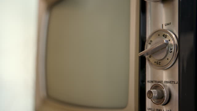 Changing channels on an old vintage Tv