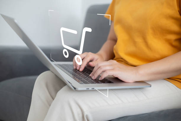 istock shopper using laptop and touch virtual screen online shopping. And online payment option or digital wallet online transaction concept. 1414737991