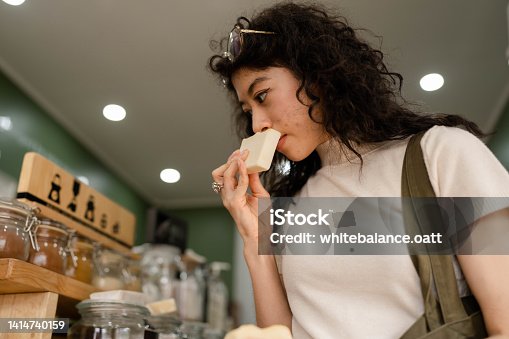 istock Asian woman with reusable bag buying personal hygiene items. 1414740159