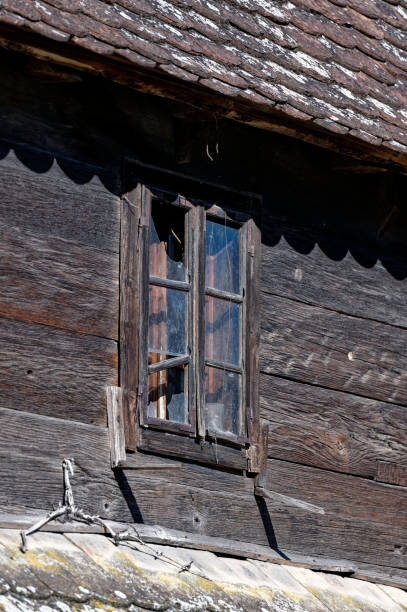 istock Old wooden house with broken window 1414741430