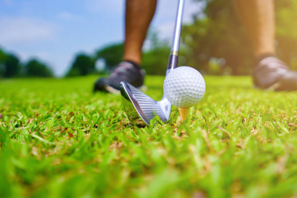 istock Golf ball on green grass ready to be struck on golf course 1414743528