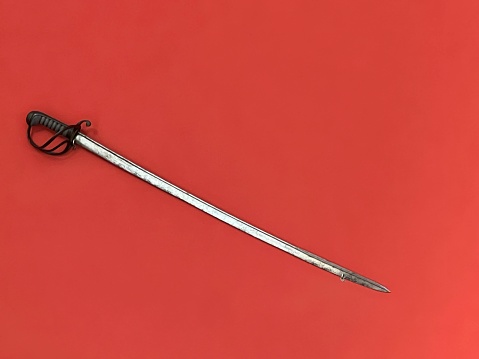 Sword hanging on a red wall