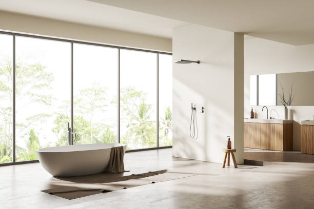 istock Light bathroom interior with bathtub, douche, sink and panoramic window 1414744811