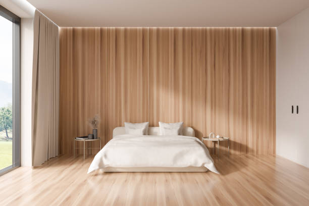 istock Wooden bedroom interior with bed and decoration, panoramic window. Empty wall 1414744913