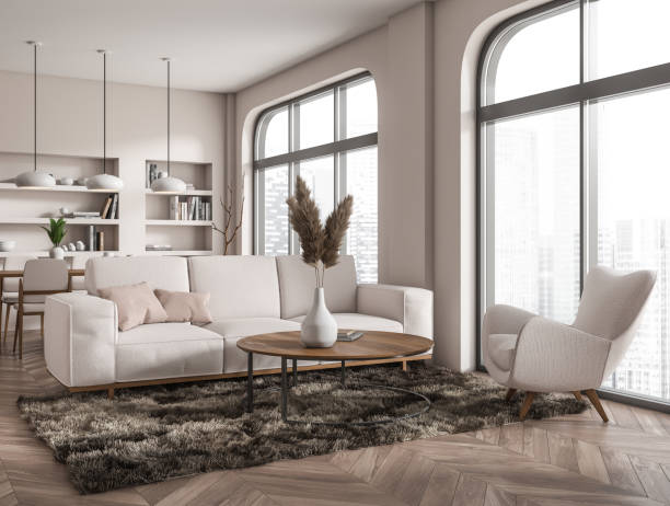 istock Chill interior with couch and armchair, shelf with decoration and panoramic window 1414744948