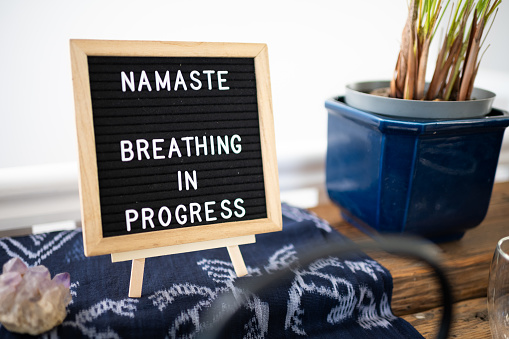 Namaste Breathing in Progress sign in yoga studio