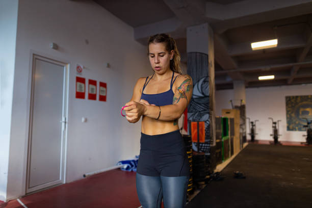 istock Sporty woman preparing for gym training 1414750676